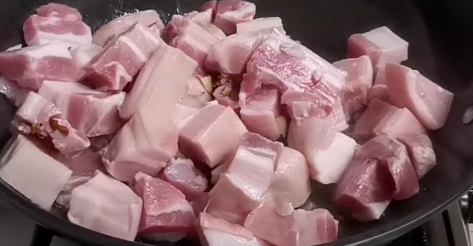 Brown the pork. Add the pork belly and cook until the edges start to brown and fat begins to render.